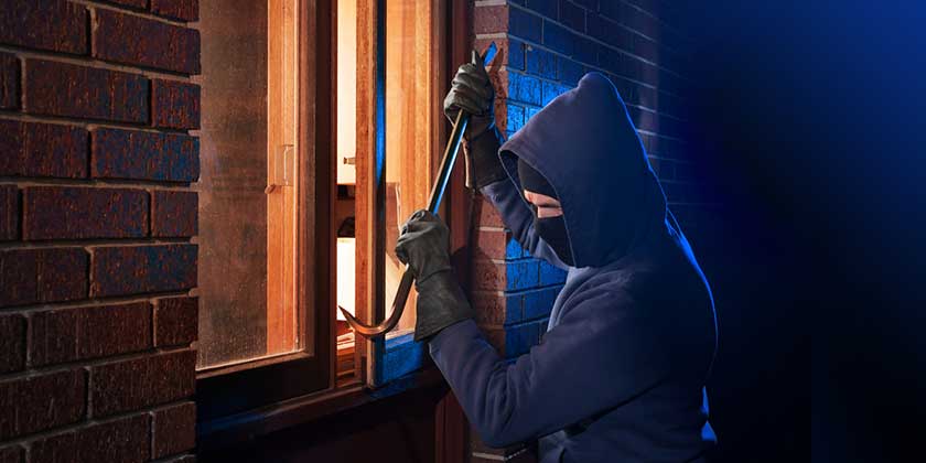 Burglar at Christmas breaking into house