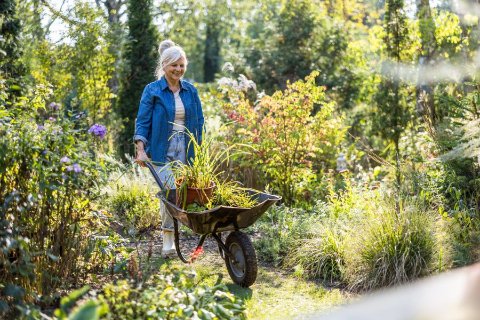 Neatly organised self storage unit with labelled boxes, ready for a seasonal belongings swap
