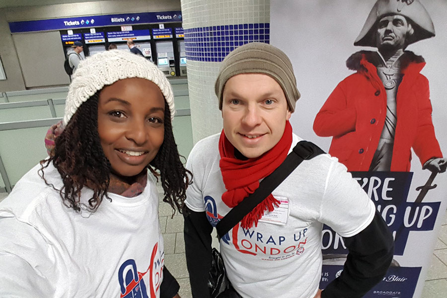 Two Safestore employees collecting donated coats for Wrap Up 2025 coat drive