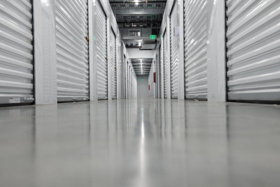 Interior view of a modern self storage facility with individual storage unit doors