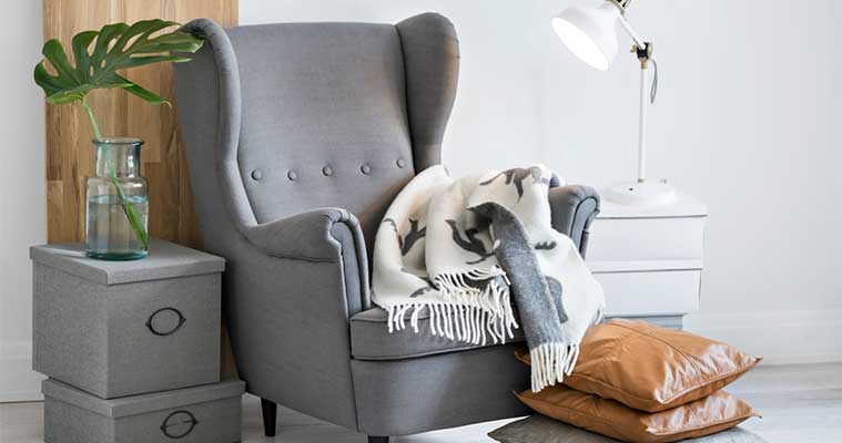 Reading corner with a wingback chair