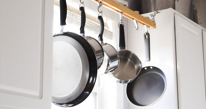Organising pots and pans by hanging them vertically