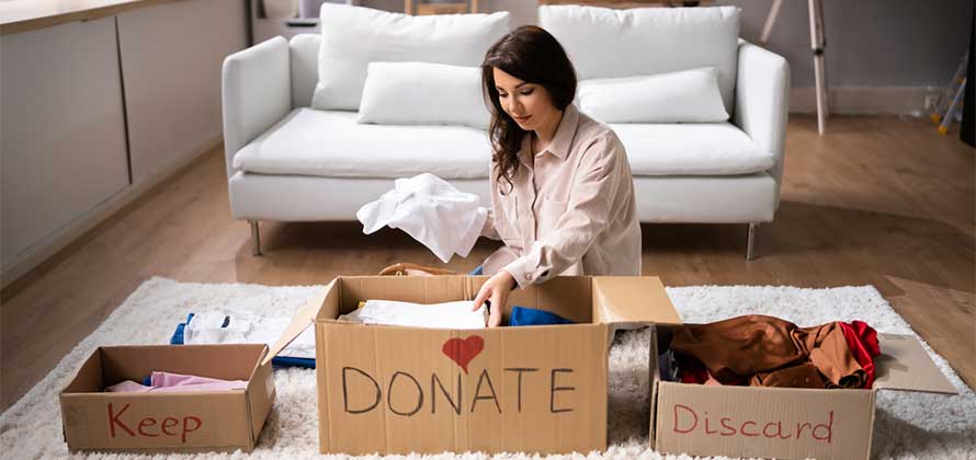 Women decluttering before moving house